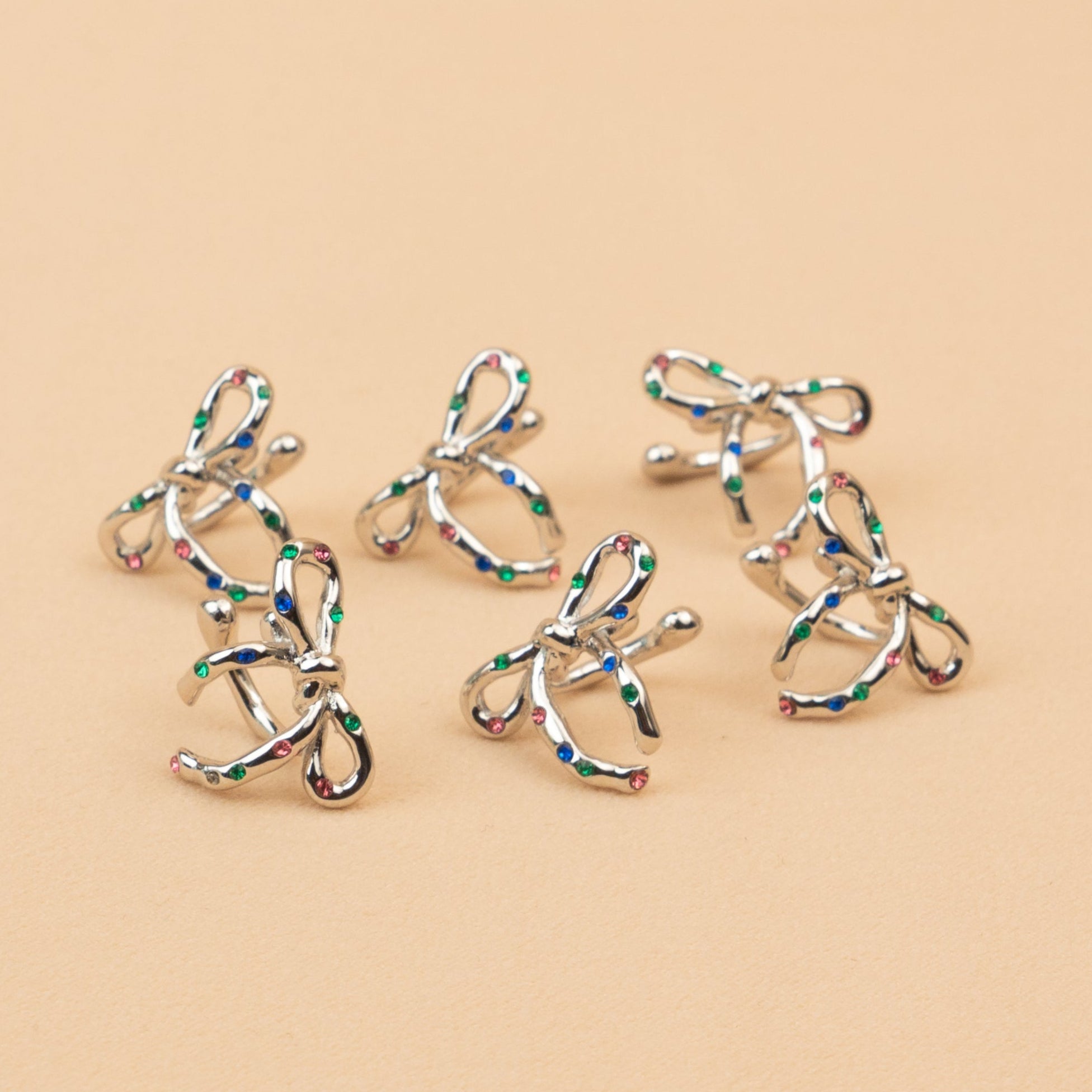 Confetti Silver Bow Ear Cuffs