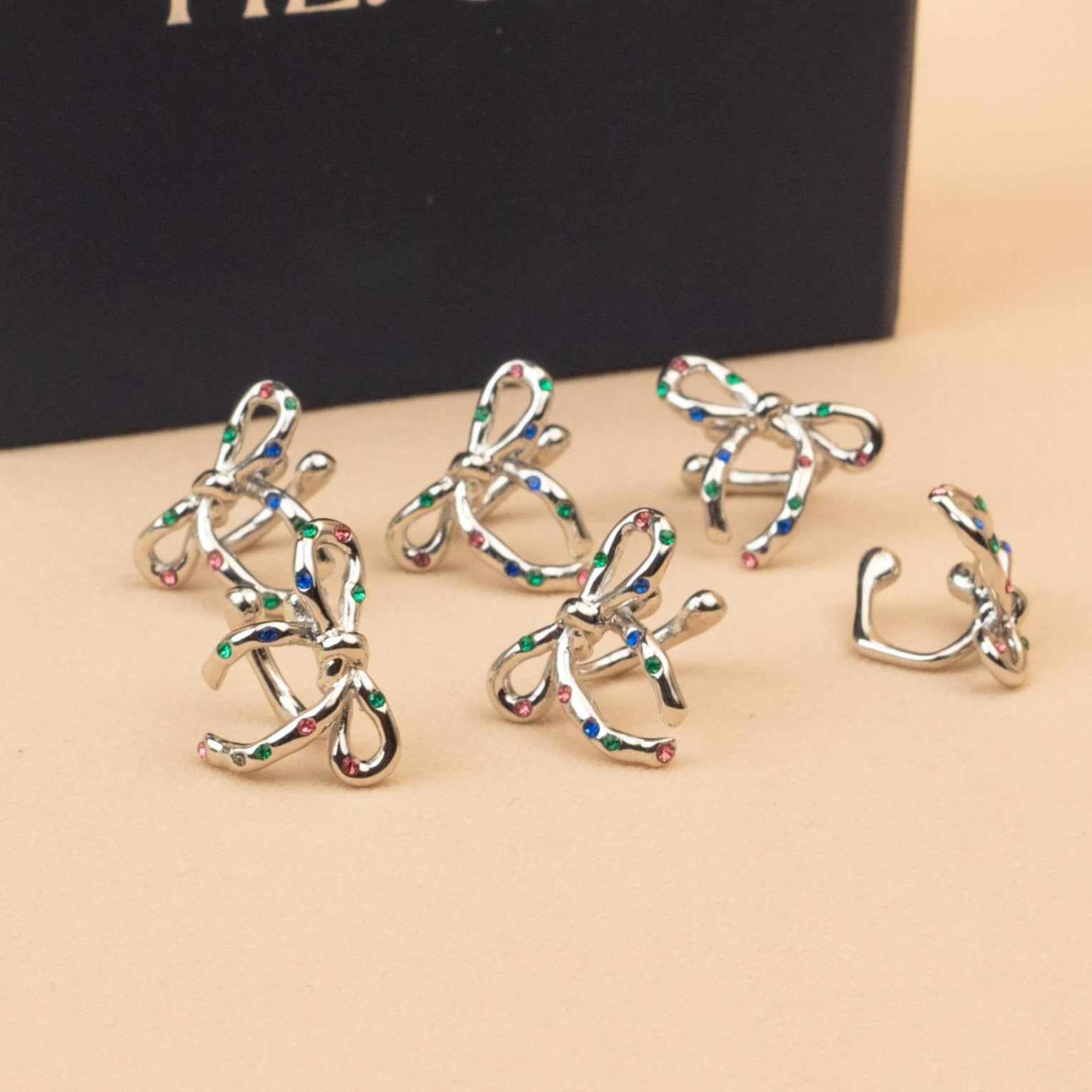 Confetti Silver Bow Ear Cuffs