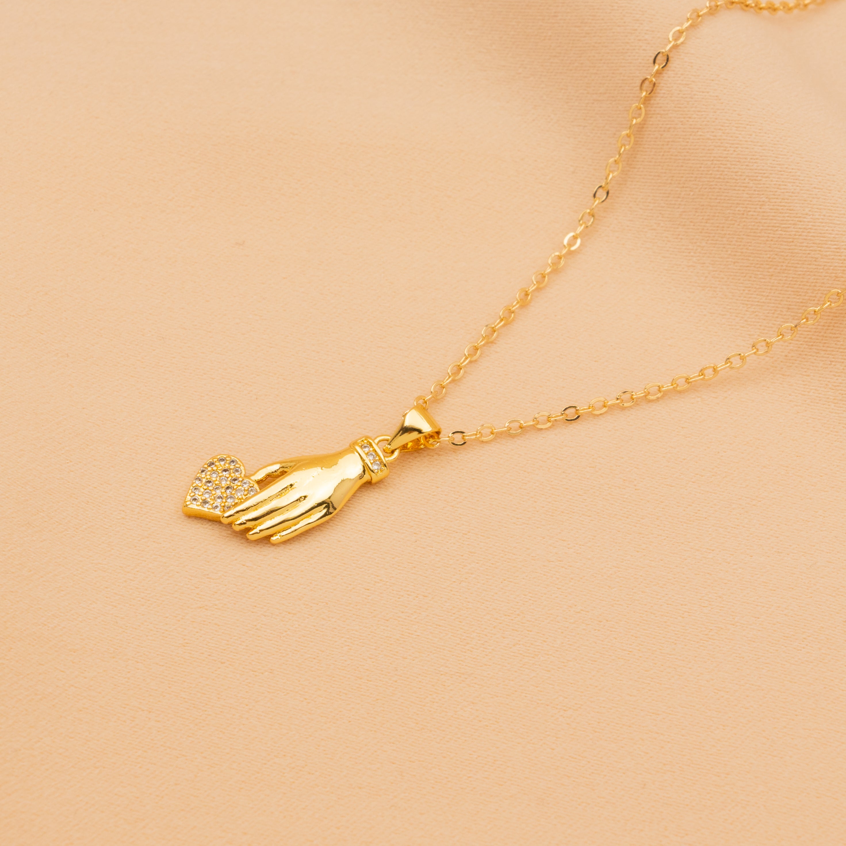 The Heart In Hand Necklace