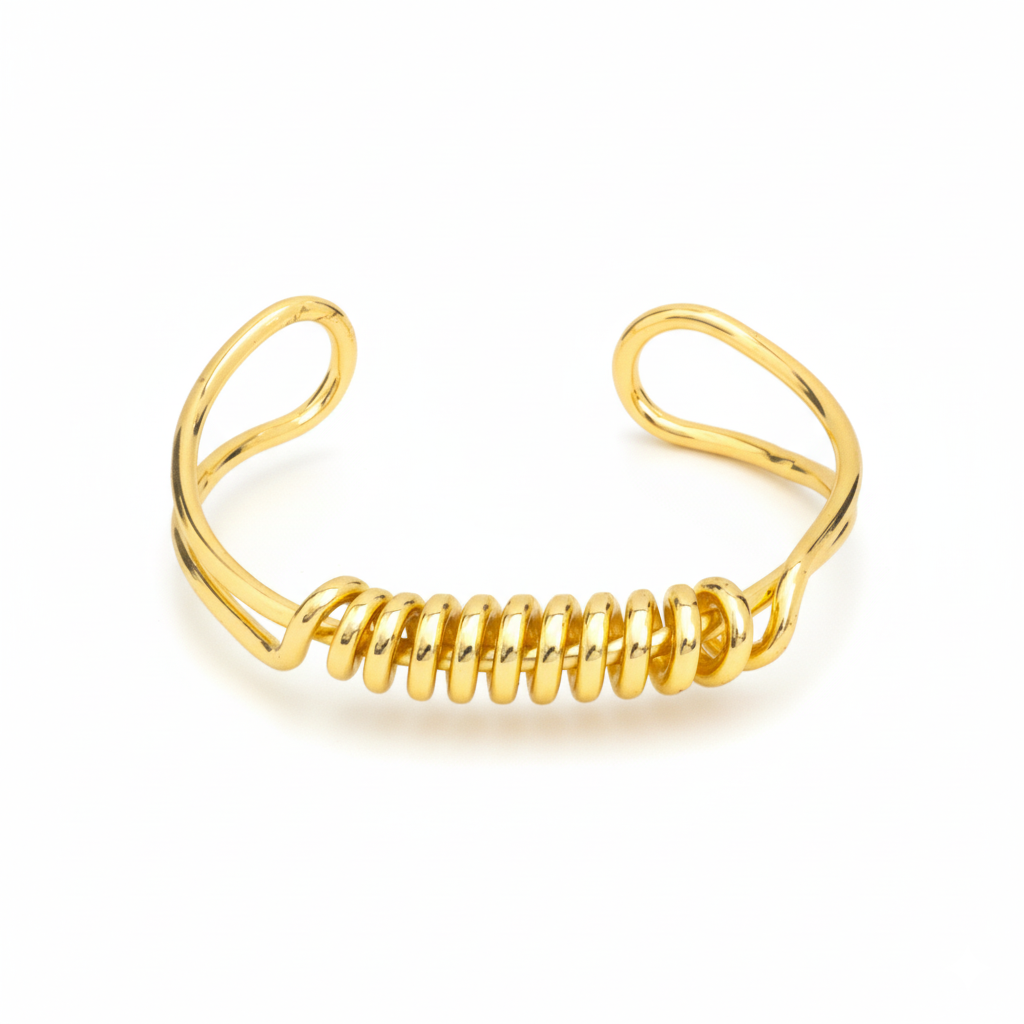 Gold coil bracelet on a white background